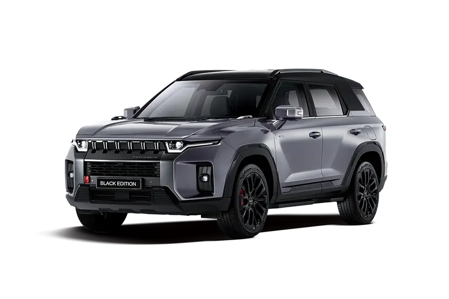 SUV aventurero KGM Torres Black Edition gris titanio con techo negro y rines deportivos oscuros.